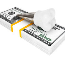 dental implant on a pile of money