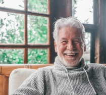 Closeup of senior man smiling at home